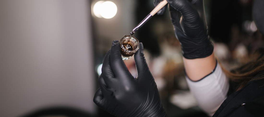 Brow dye in hands of brow artist